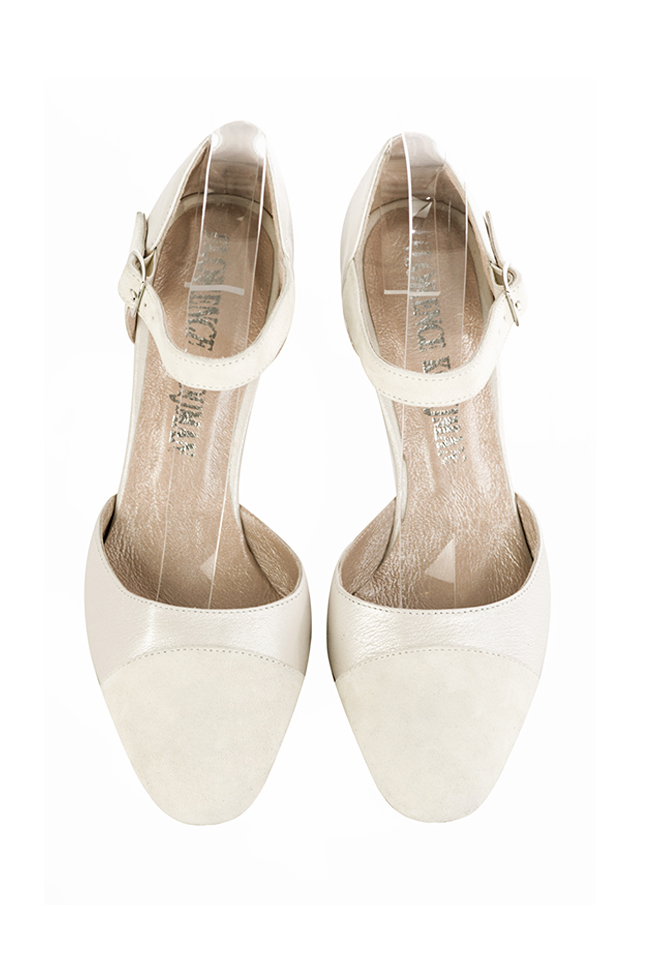 Women's off white and pure white open side dress shoes, with an instep strap. Round toe. High kitten heels - Top view